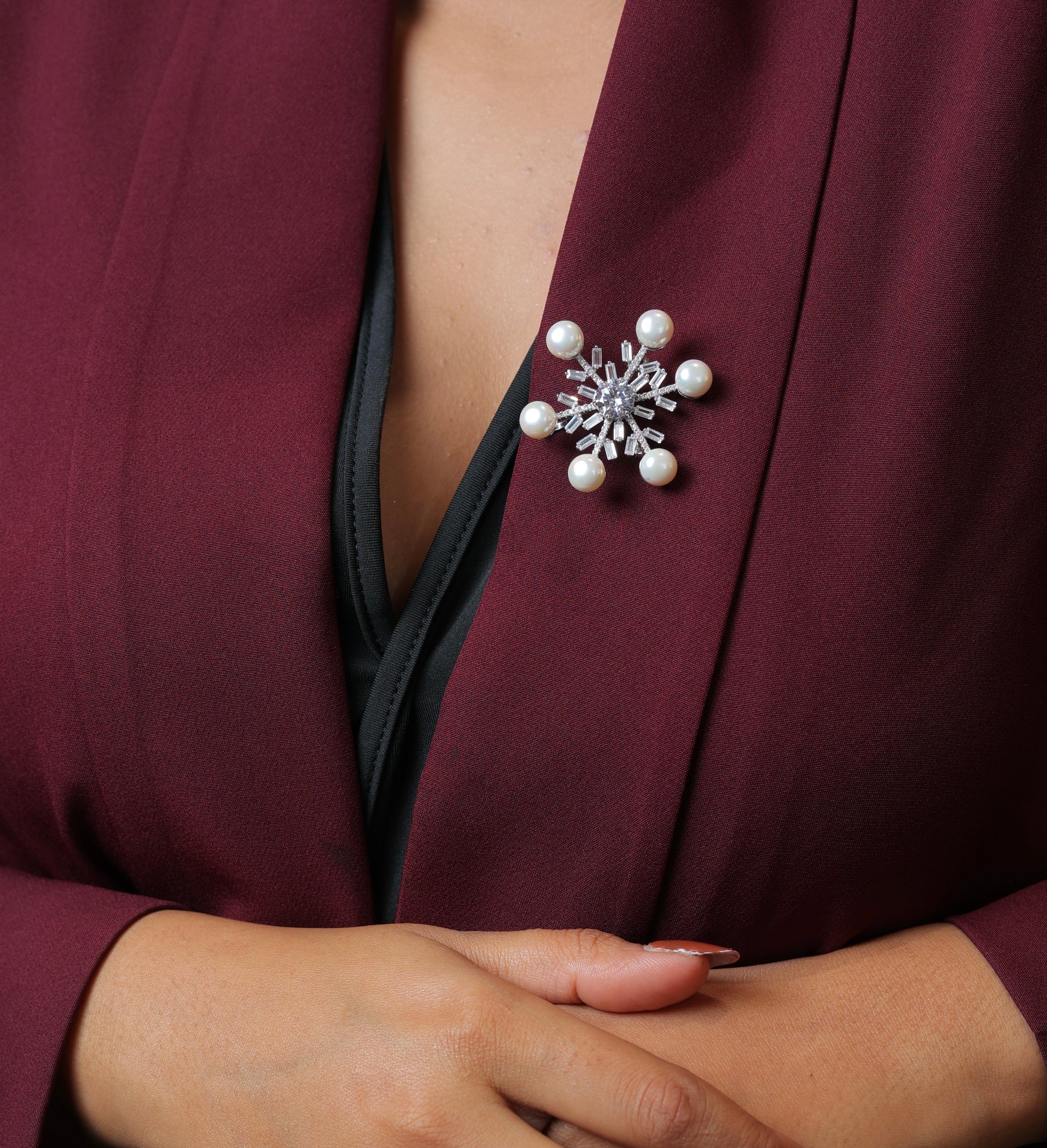 Silver snowflake brooch with pearls